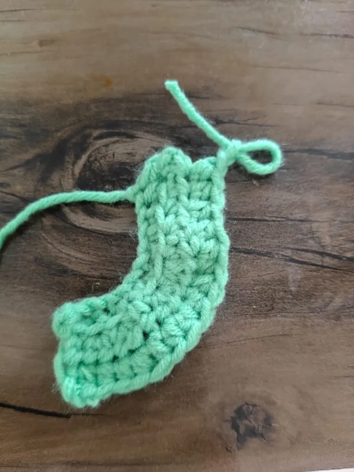 A crochet leaf in mint green yarn